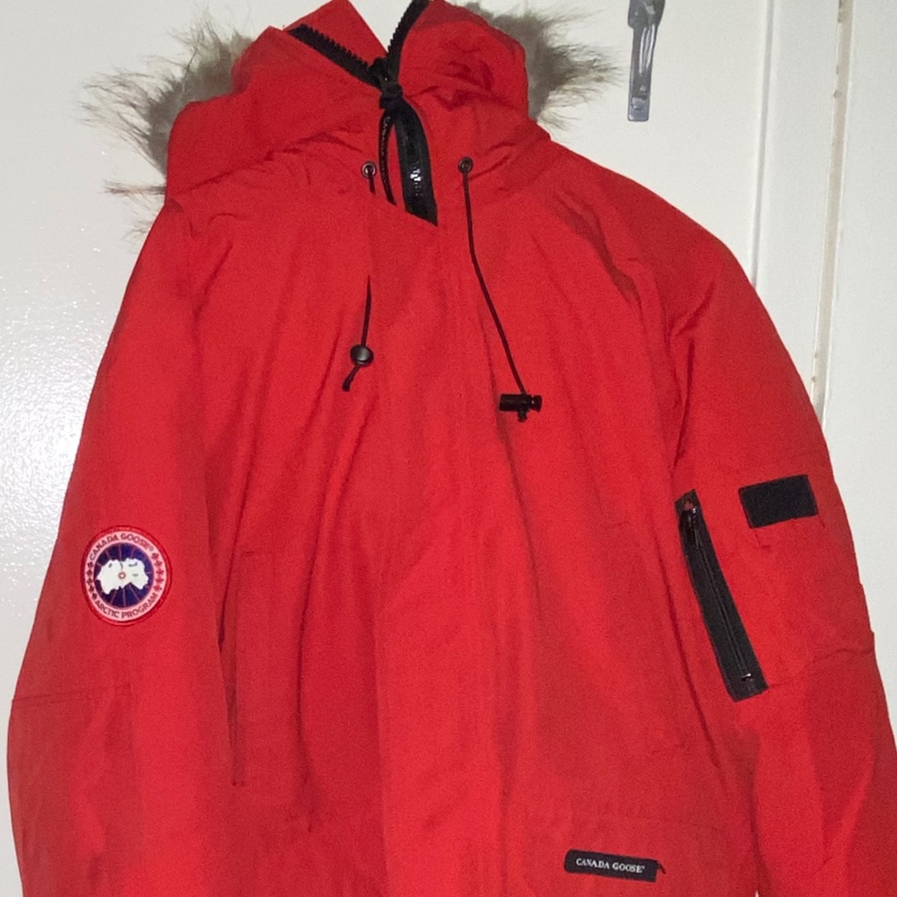 Men large Canada goose coat. Red. Slightly worn. Red. $300.